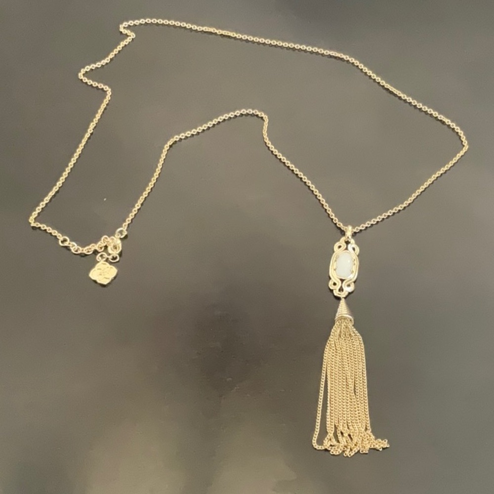 Kendra Scott Tassel necklace in gold with white stone.